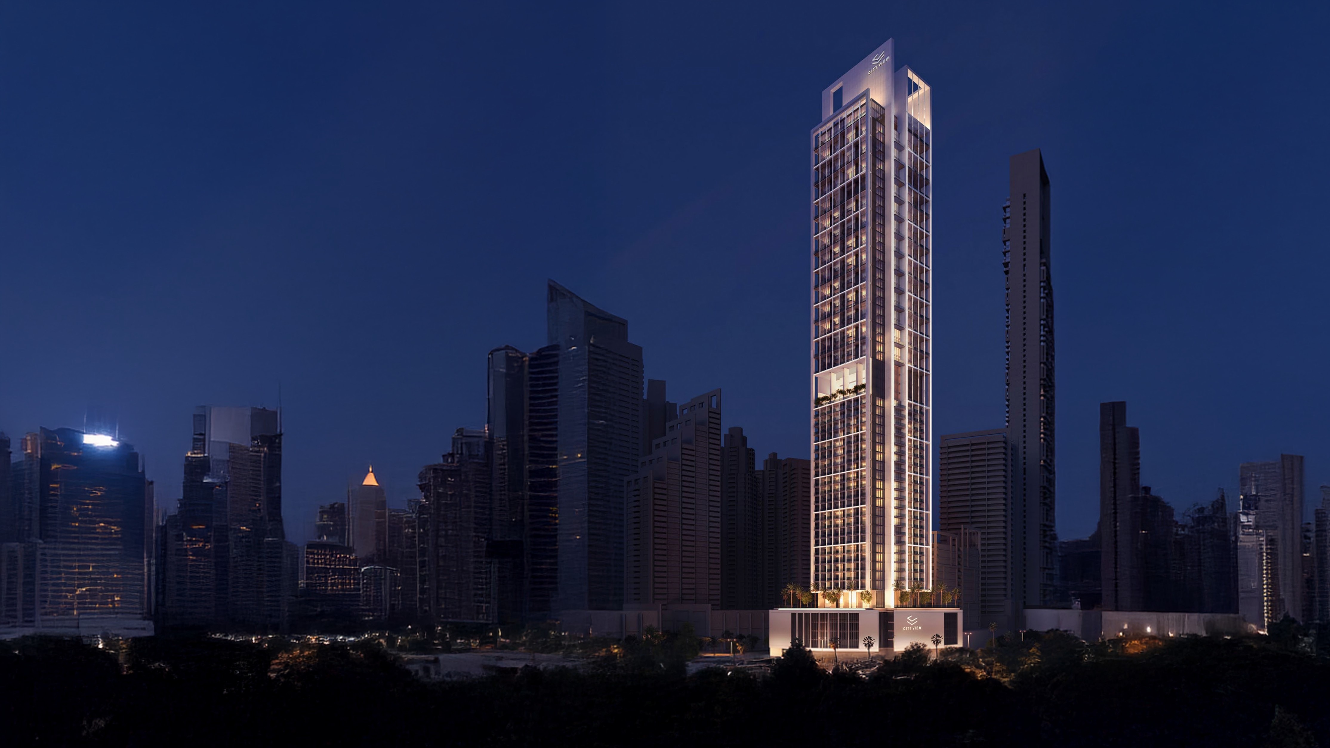 Sofitel Residences Dubai City View - Luxury tower illuminated at night in Downtown Dubai