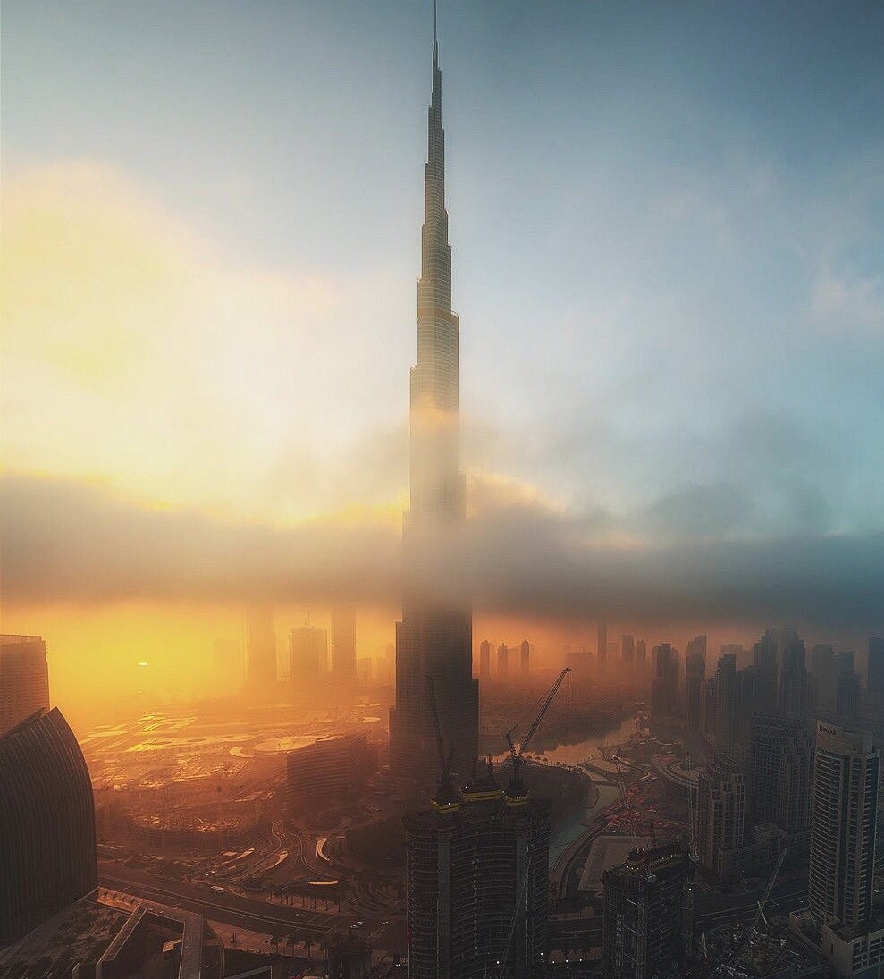 Burj Khalifa at sunrise through morning fog