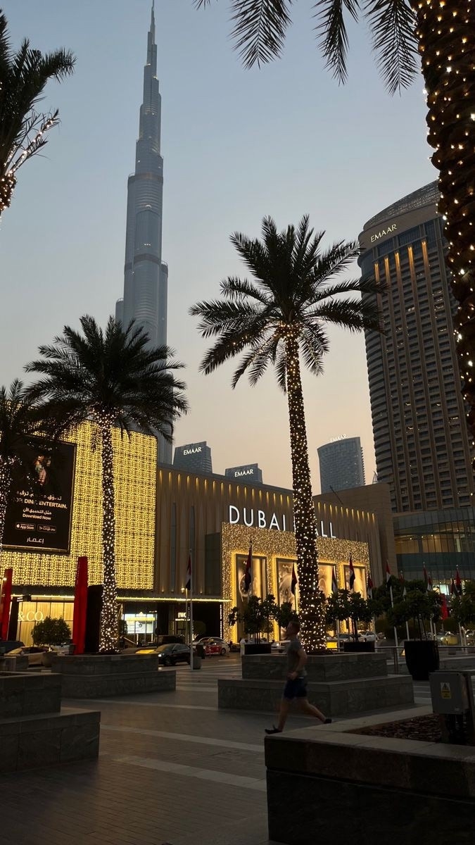 Dubai Mall entrance with palm trees and Burj Khalifa